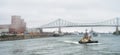 FREMM Languedoc & Svitzer Cartier tugboat Royalty Free Stock Photo