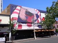 Fremont St downtown Las Vegas, wall art. girl with red and white shirt, hat, glasses