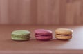 Frence sweet delicacy macaroons on grunge wood background Royalty Free Stock Photo