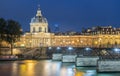 The French Academy et pont des Arts at night , Paris, France.