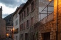 French alley with typical facade houses of Villefranche de Conflent at sunset. Royalty Free Stock Photo