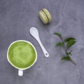 French almond cake makarons, green leaf, matcha tea