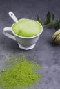 French almond cake makarons, green leaf, matcha tea