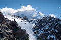 French Alps breathtaking landscape with a mountain hut with sunny blue sky and snowy Aiguille de Bionnassay 4052m mountain. Mont