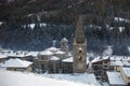 French Alps in winter: the ancient belfry in a little mountain Royalty Free Stock Photo