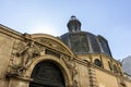 French architecture with statues over the door