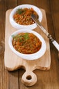 French aubergine eggplant caviar with oil in white bowl on wood