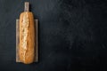 French baguette bread, on black background, top view flat lay  with copy space for text Royalty Free Stock Photo