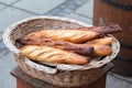 French baguettes in a wicker basket. Outdoor Royalty Free Stock Photo