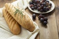 French baguettes on wooden table, rustic style. Pastry, breakfast, bread for sandwich isolated, copy space Royalty Free Stock Photo