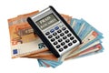 French bank charges concept with a calculator lying on euro banknotes on a white background Royalty Free Stock Photo