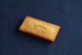 French biscuit Financier on navy blue table cloth