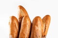 Baguette bread in paper bag on white background