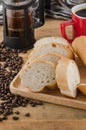 French bread, baguette with coffee beans on wooden background Royalty Free Stock Photo