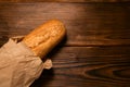 French bread baguette cut on vintage wooden bread board with knife Royalty Free Stock Photo