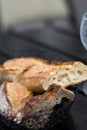 French bread, baguette sliced on slate background. Royalty Free Stock Photo