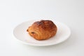 French bread pain au chocolat chocolate croissant on plate on white background Royalty Free Stock Photo