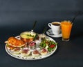 French breakfast - corn porridge, croissant with sliced chicken, rucola, tomato and cheese salad with pesto sauce, boiled chicken Royalty Free Stock Photo