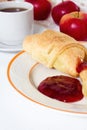French Breakfast - croissant, jam, honey, apple and coffee on wooden background. Royalty Free Stock Photo