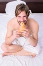 French breakfast stereotype. Man eats croissant he likes bakery products. Fresh bakery product. Man bearded handsome guy