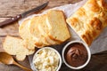 French brioche bread and cream mascarpone cheese, chocolate cream close-up. Horizontal top view Royalty Free Stock Photo