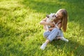 French bulldog kissing female owner in park. Royalty Free Stock Photo