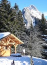 French chalet with mountains on the background Royalty Free Stock Photo