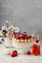 French charlotte cake with summer fruits decorated with pansy flowers