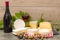 French cheese with a glass and a bottle of wine Royalty Free Stock Photo