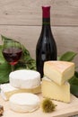 French cheese with a glass and a bottle of wine Royalty Free Stock Photo