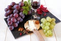 French cheese, grapes, walnuts and glass of red wine