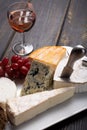 French cheeses plate in assortment, blue cheese, brie, munster, Royalty Free Stock Photo