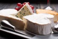 French cheeses plate in assortment, blue cheese, brie, munster,