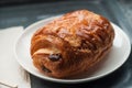 french chocolatine on table in a white plate Royalty Free Stock Photo