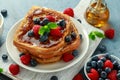 French cinnamon toast with blueberries, raspberries, maple syrup and coffee. morning breakfast Royalty Free Stock Photo