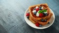 French cinnamon toast with blueberries, raspberries, maple syrup and coffee. morning breakfast Royalty Free Stock Photo