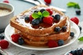 French cinnamon toast with blueberries, raspberries, maple syrup and coffee. morning breakfast Royalty Free Stock Photo