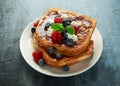 French cinnamon toast with blueberries, raspberries, maple syrup and coffee. morning breakfast Royalty Free Stock Photo