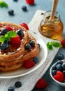 French cinnamon toast with blueberries, raspberries, maple syrup and coffee. morning breakfast Royalty Free Stock Photo