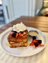 French cinnamon toast with cream, peanut butter, blueberries, raspberries, maple syrup and coffee. morning breakfast Royalty Free Stock Photo