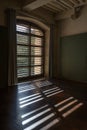 French classical architecture interior with wooden windows and shadows Royalty Free Stock Photo