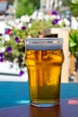 French cold beer in misted glass served on outdoor terrace in small Alpine village in France