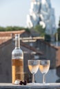 French cold rose dry wine from Provence in two glasses in day with view on old roofs of Arles town in sunny day Royalty Free Stock Photo