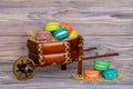 Colored French Macarons in a basket. Macarons on straw.