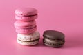 French Colorful Macarons Colorful Pastel Macarons on Pink Background Green Beige and Pink Macaron on Pink Background Sweet and