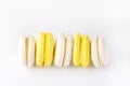 French Colorful Macarons White and Yellow Macarons on White Background Dessert