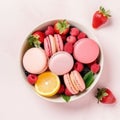 French colorful macaroons on a plate. Pink background.