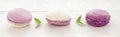 French cookies purple macaroons white background