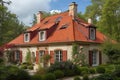 french country house roof with bold red tile roof and dormer windows