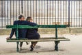 French couple sitting on a bench Royalty Free Stock Photo